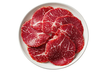 Raw beef slices arranged on a white plate
