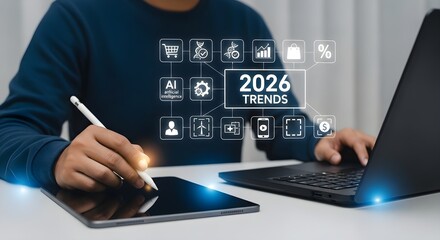 Man analyzing 2026 trends using digital devices.