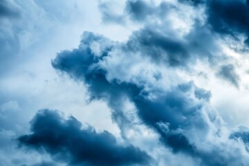 Obraz premium Dark stormy clouds in a light blue sky storm clouds