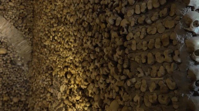 The Chapel of Bones located in the city of Evora built by Franciscan Monks and decorated with human skulls and bones on the sides creating a macabre design.