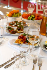 A beautifully arranged plate of assorted bruschetta, canapes, and marinated appetizers