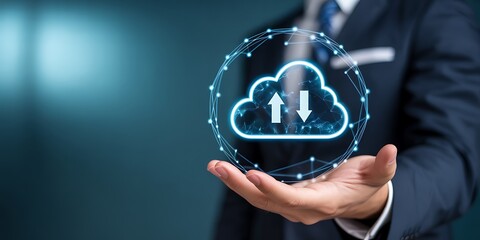 Businessman holding a glowing digital cloud icon with upload and download arrows