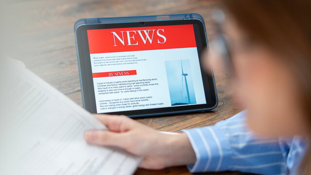 business woman using tablet pc for reading news
