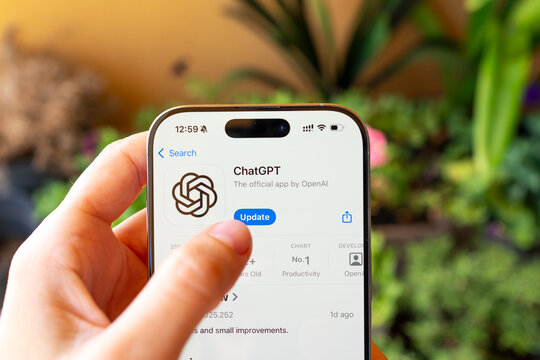 Rijeka, Croatia - September 17, 2025: close-up of a hand touching the update button for the ChatGPT app on the App Store screen