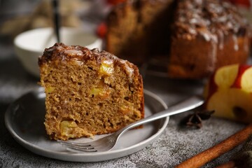 Homemade Apple fritter bread or loaf with cinnamon glaze and strusel topping, selective focus
