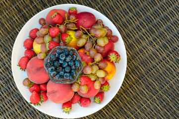 plate full of berries and fruits