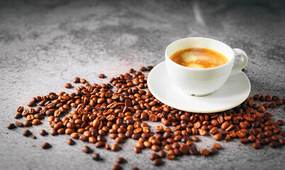 Coffee cup and coffee beans on gray background, Espresso crema coffee cup aromatic