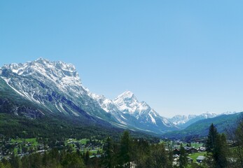 Panoramic View of Snow-Capped Mountains and Alpine Village