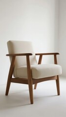 Mid-century modern armchair with wooden frame and cream upholstery
