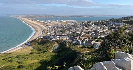 Chesil Beach on the left and Portand harbour on the right in Dorset UK