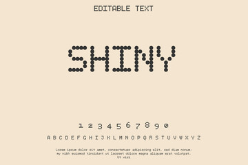 Retro digital font with editable text and numbers on a pale background