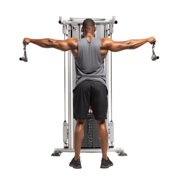 Focused on fitness, a muscular man executes a lateral raise exercise on a cable machine