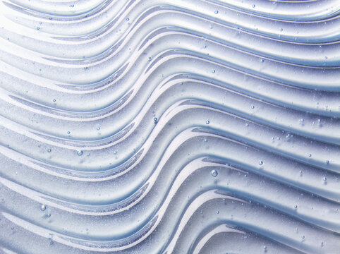Blue clear cosmetic gel serum oil bubble texture Hyaluronic skin care moisturizer product sample with bubbles macro