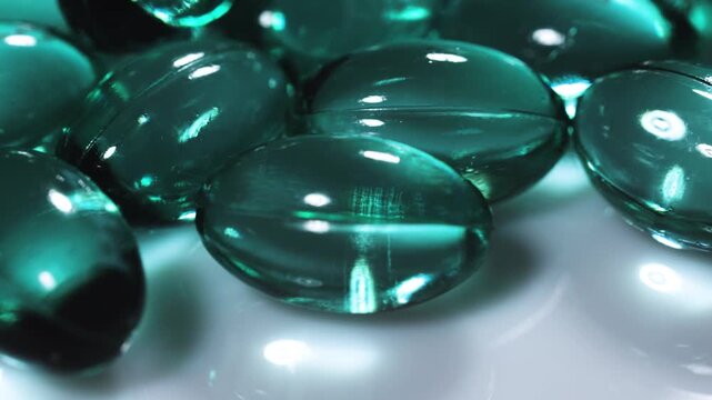 Blue green pill capsules isolated, analgesic pile, painkiller drugs, sedative pills group, medicine gel capsules on white background.