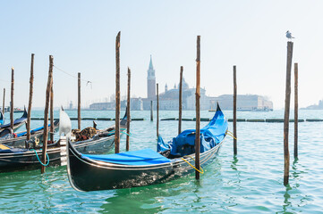 Gondolas on the Grand canal at sunset in Venice, Italy.
