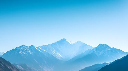 Fototapeta premium Majestic mountain range under a clear blue sky, showcasing natural beauty and tranquility