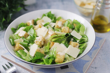 A bowl with classic Caesar salad	
