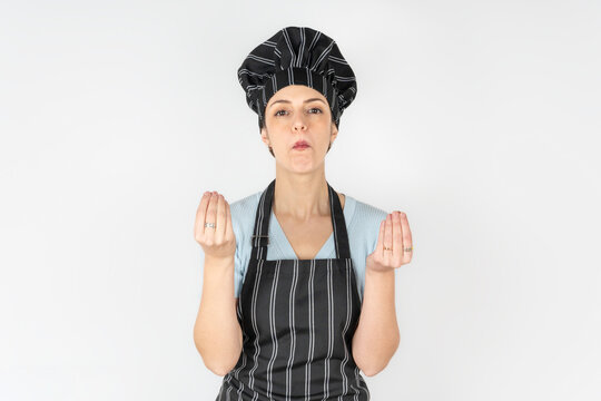 Culinary expert making a "finger purse" gesture