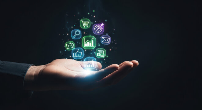 A hand presents glowing digital icons representing marketing, finance, communication, and business growth, suggesting innovation and technological advancement.