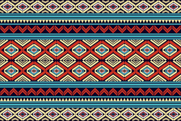 Seamless ethnic tribal geometric pattern with diamond shapes in red, blue, and beige tones. Traditional ikat inspired textile design for fabric, wallpaper, background, and decoration