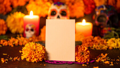 Greeting card on altar with marigold, sugar skull and candle. Traditional Dia de los Muertos