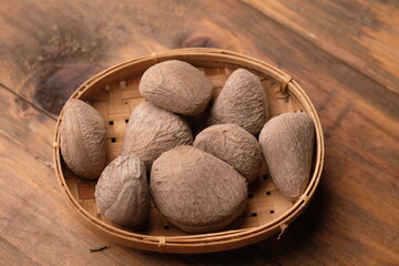 Kepayang, pangi, or kaloa is a tree that grows wild or is planted in gardens, which produces a cooking spice known as keluak. Pangium edule. Kluwak nut. 