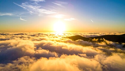 Fototapeta premium Golden sunset above a sea of clouds
