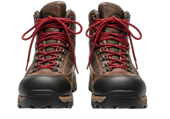 A pair of rugged hiking boots with red laces positioned centrally against a white background