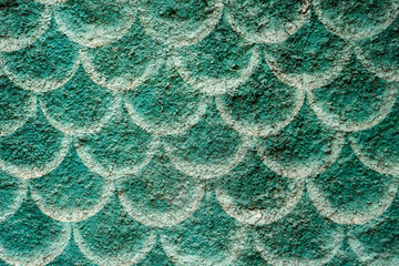 An abstract pattern resembling fish scales or overlapping circles, rendered in a textured green and white paint, creates a visually captivating surface. Isolated in white background to improve design. © Pernandi Imanuddin