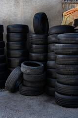 Stacks of Used Car Tires in Outdoor Storage Yard