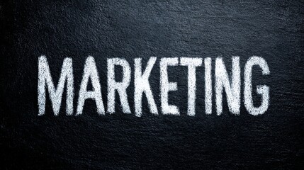 Marketing concept displayed on black chalkboard background in white chalk letters