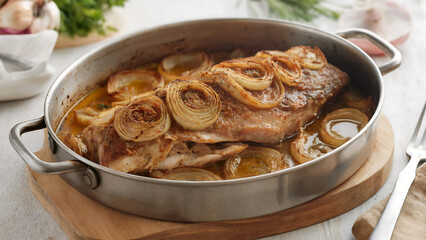 Plakia is meat or fish with lots of onions, baked in the oven.