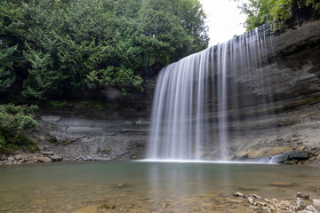 Bridal Veil Falls on Manitoulin Island offers a serene and picturesque glimpse into Ontario's natural beauty with its cascading waters and lush surroundings.