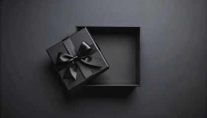 Open black gift box on dark background
