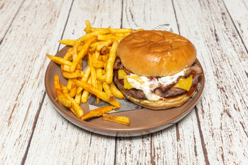 Close-up of the grill mark on the beef inside a burger with a lightly pressed brioche bun