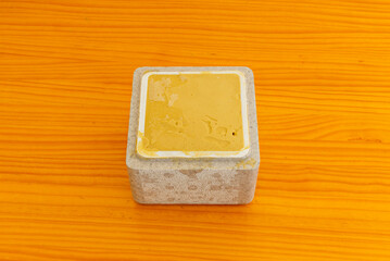 Pistachio ice cream tub with roasted pistachio pieces