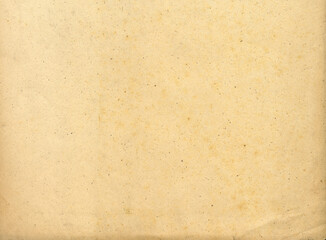 Vintage aged parchment paper texture with stains and dirt for antique book and retro background design
