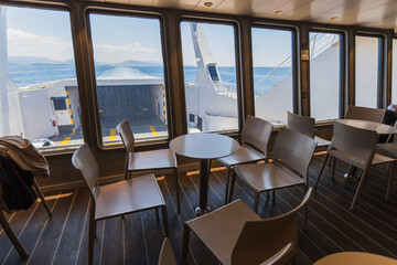 Modern ferry interior seating with ocean views