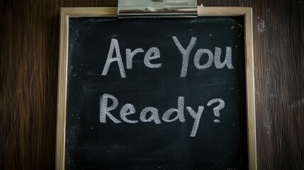 Fototapeta premium Chalkboard message: are you ready? motivational sign on wooden frame