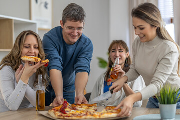 Friends enjoy pizza and drinks during a cozy gathering in a bright living room on a weekend afternoon