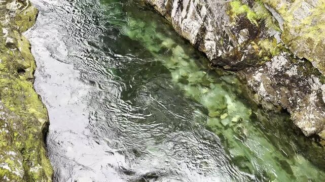 A clean river among stones and rocks