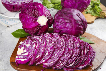 Fototapeta premium Fresh Purple Cabbage and Kale Vegetables on Wooden Cutting Board - Healthy Organic Cooking Ingredients