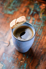 Cup of coffee on rustic wooden background. Soft focus. Copy space	