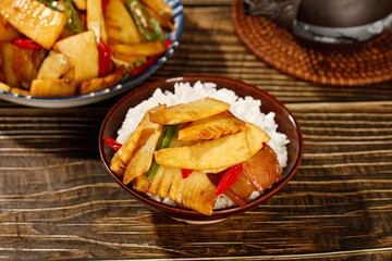 Fresh Bamboo Shoots Stir Fry with Rice - Traditional Asian Vegetable Dish on Wooden Table