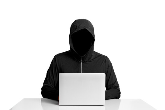 Faceless person in hoodie using laptop computer, isolated on white background, concept of hacking, cybercrime, data security, and digital technology - Powered by Adobe