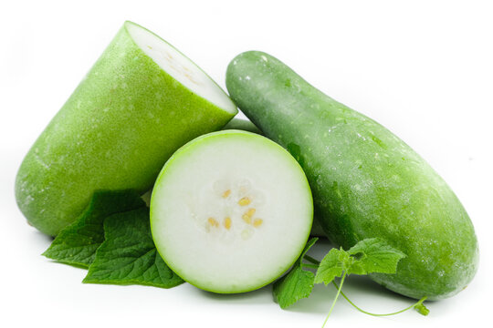 Fresh Winter Melon Sliced and Whole with Green Leaves on White Background