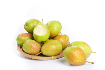 Fresh Pears in Wicker Basket with Cut Pear Showing White Flesh on White Background