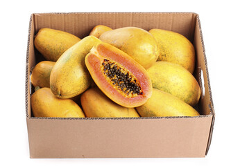 Fresh Ripe Papayas in Cardboard Box with Cut Papaya Showing Seeds and Orange Flesh