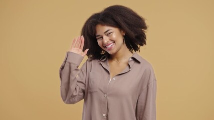 Woman waving hand - hello, or salute, chao, adios. Parting, say bye to camera. 