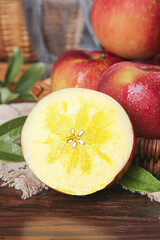Fresh Red Xinjiang Fuji Apples Cut Display on Wooden Surface - Healthy Organic Fruit